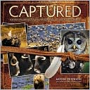 Book cover image of Captured: Lessons from Behind the Lens of a Legendary Wildlife Photographer by Moose Peterson