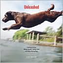 Book cover image of Unleashed: Climbing Canines, Hiking Hounds, Fishing Fidos, and Other Daring Dogs by Lisa Wogan