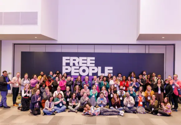 Photo of a large group of PLA 2024 Conference attendees in front of the "Free People Read Freely" wall Photo of a large group of PLA 2024 Conference attendees in front of the "Free People Read Freely" wall