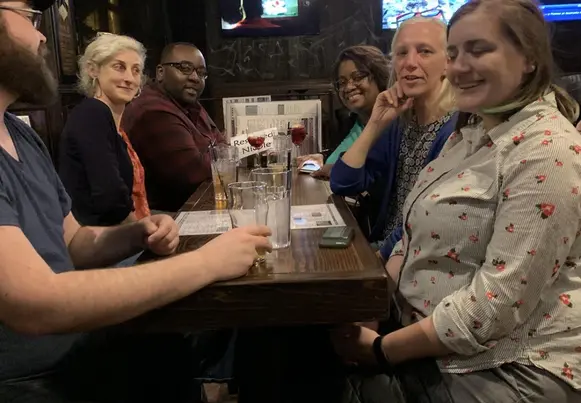 A gathering of trainers meeting at the pub after work. A gathering of trainers meeting at the pub after work.