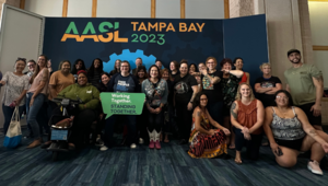 AASL Photo Booth in Tampa AASL Photo Booth in Tampa with a posed group of more than 30 members. smiling for the camera.